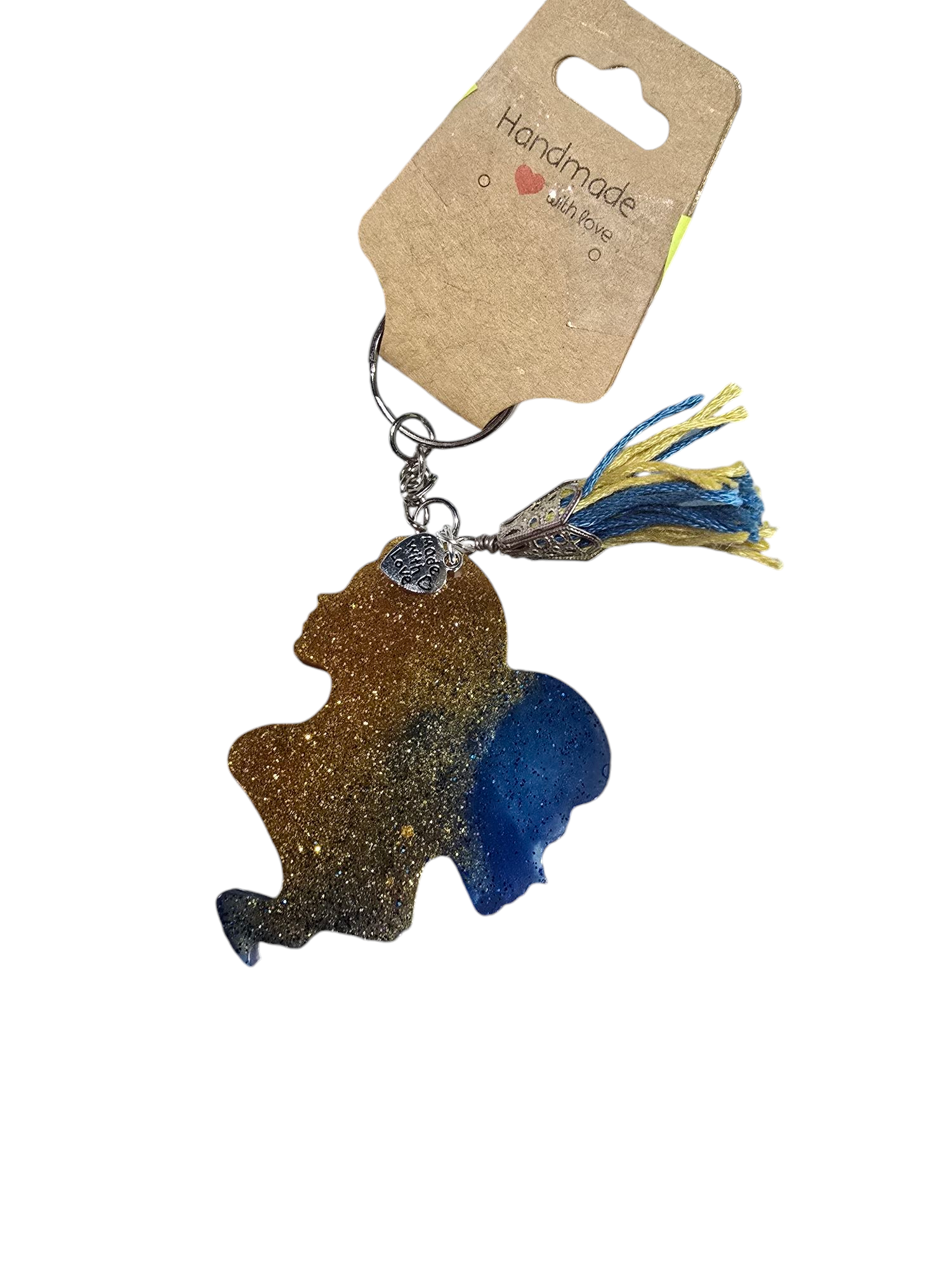 Keychain with a silhouette design and tassel on a white background